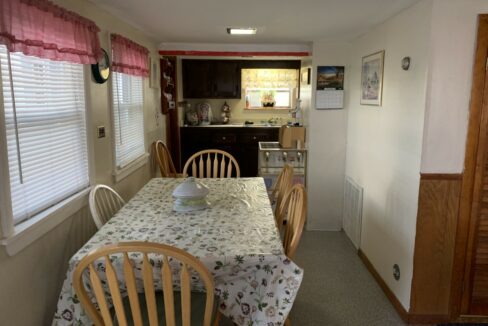 a kitchen with a table and chairs in it.