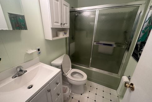 a bathroom with a shower and toilet.