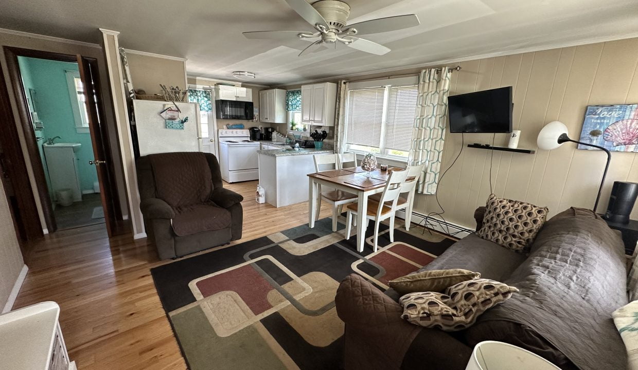 a living room with a couch and a table.