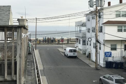 a white van parked on the side of a road.