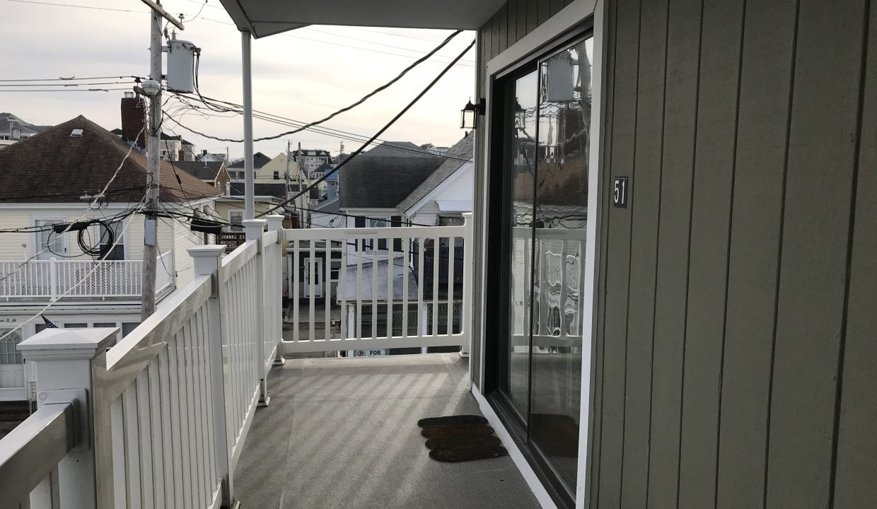 a balcony with a view of a city.