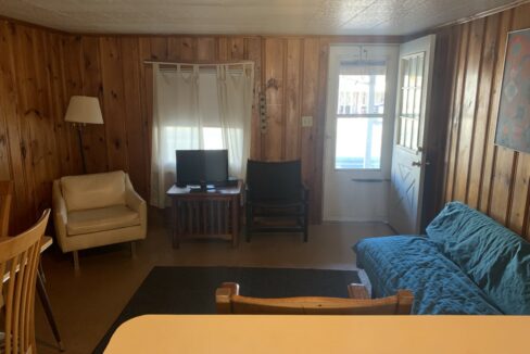 a living room filled with furniture and a flat screen tv.