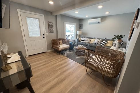 a living room filled with furniture and a flat screen tv.