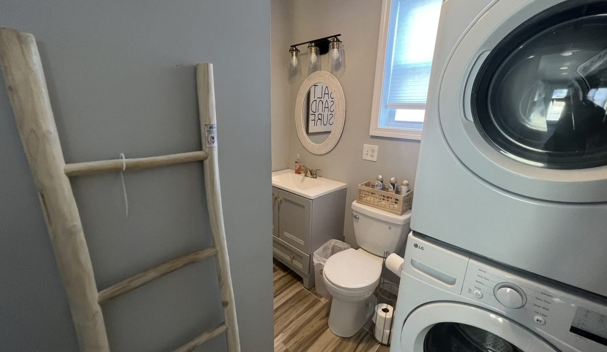 a washer and dryer in a small bathroom.