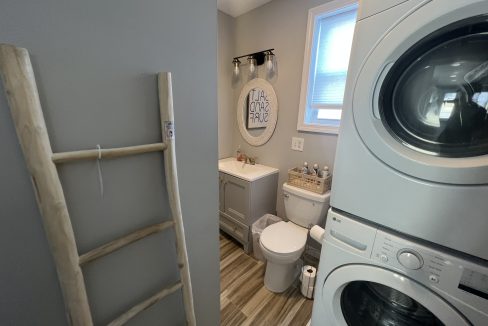 a washer and dryer in a small bathroom.