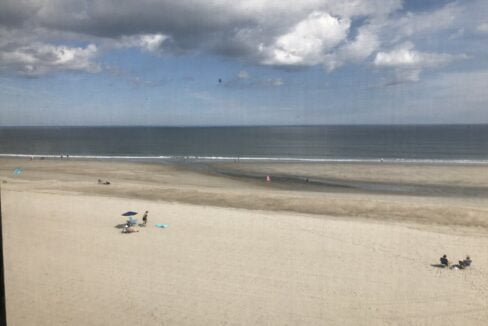 a view of a beach from a window.