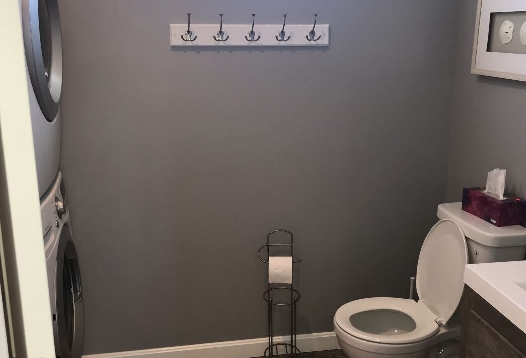a washer and dryer in a small bathroom.