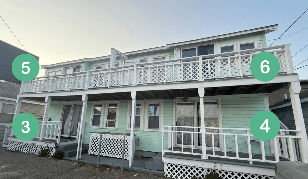 A two-story mint green house with a white railing and four stairways, each marked with numbered green circles: 3 and 4 below, 5 and 6 above.