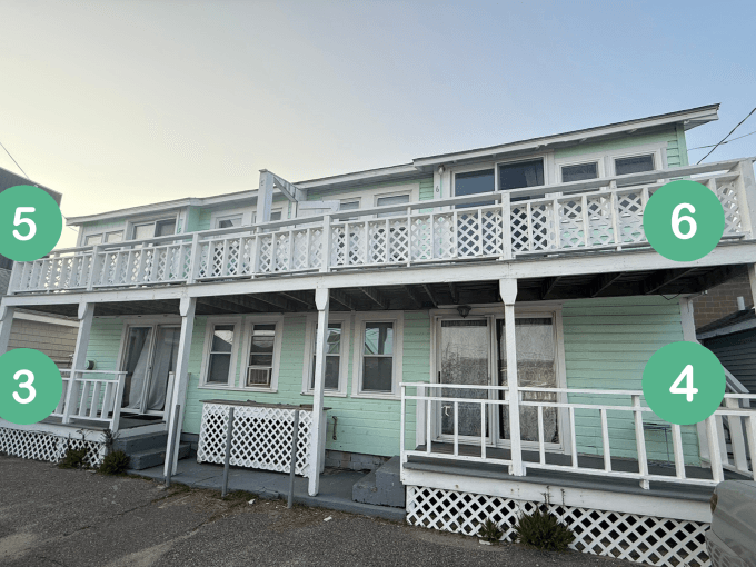 A two-story mint green house with a white railing and four stairways, each marked with numbered green circles: 3 and 4 below, 5 and 6 above.