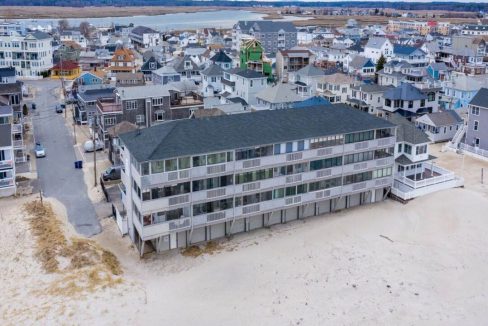 an aerial view of a beach front town.