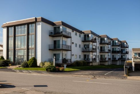 an apartment building with balconies and balconies on the second floor.