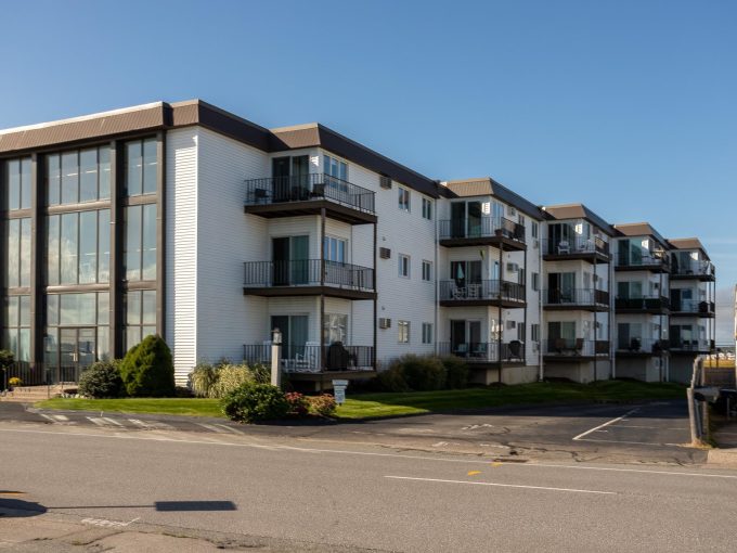 an apartment building with balconies and balconies on the second floor.