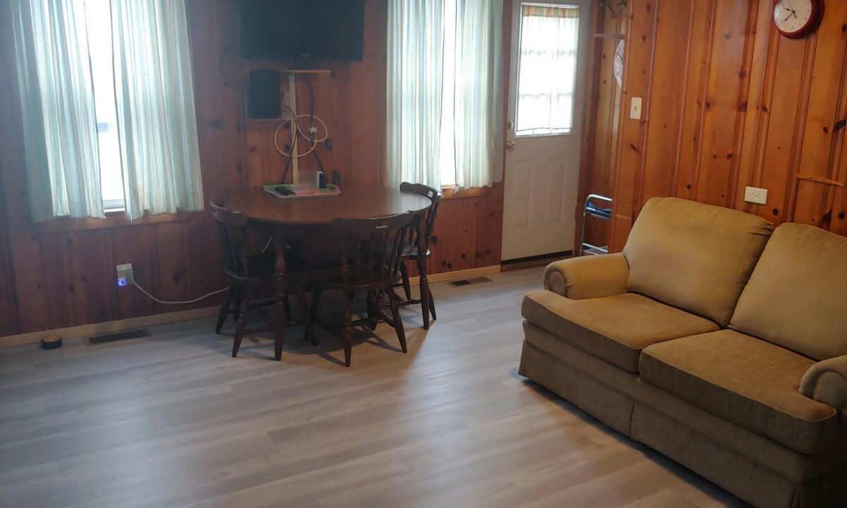 a living room filled with furniture and a flat screen tv.