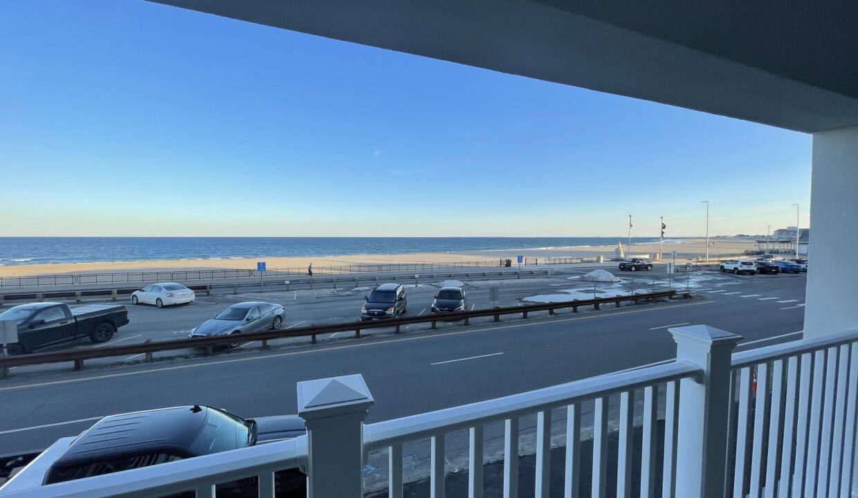 a view of a parking lot from a balcony.