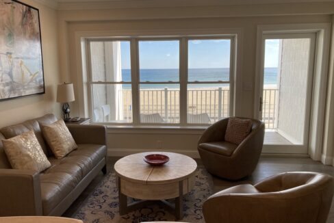 a living room filled with furniture and a flat screen tv.