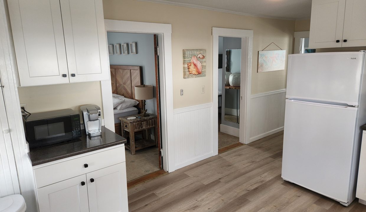 a white refrigerator freezer sitting inside of a kitchen.