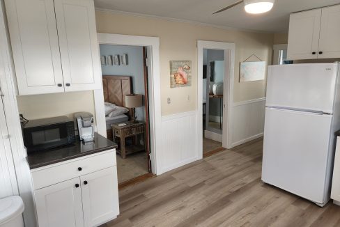 a white refrigerator freezer sitting inside of a kitchen.