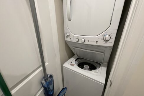 a washer and dryer in a small room.