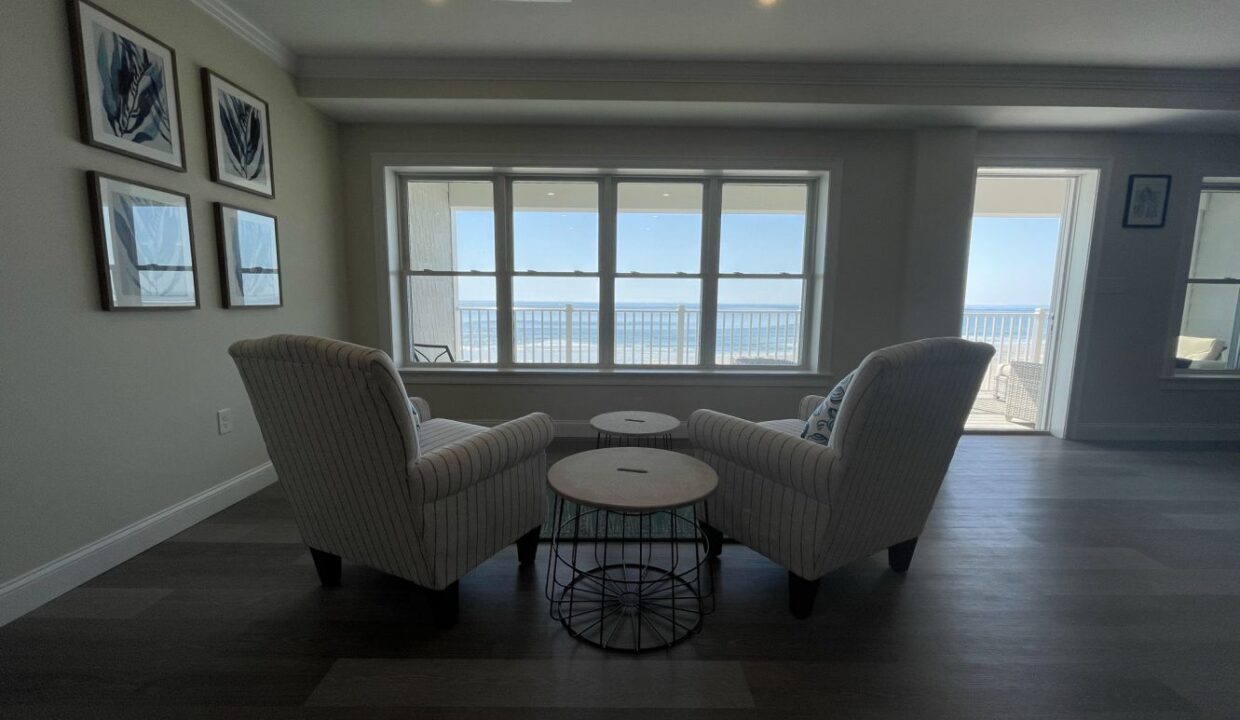 a living room with two chairs and a table.