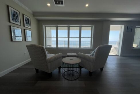 a living room with two chairs and a table.