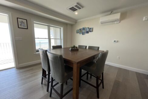 a dining room with a table and chairs.