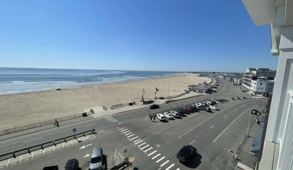 a view of a beach from a balcony of a building.