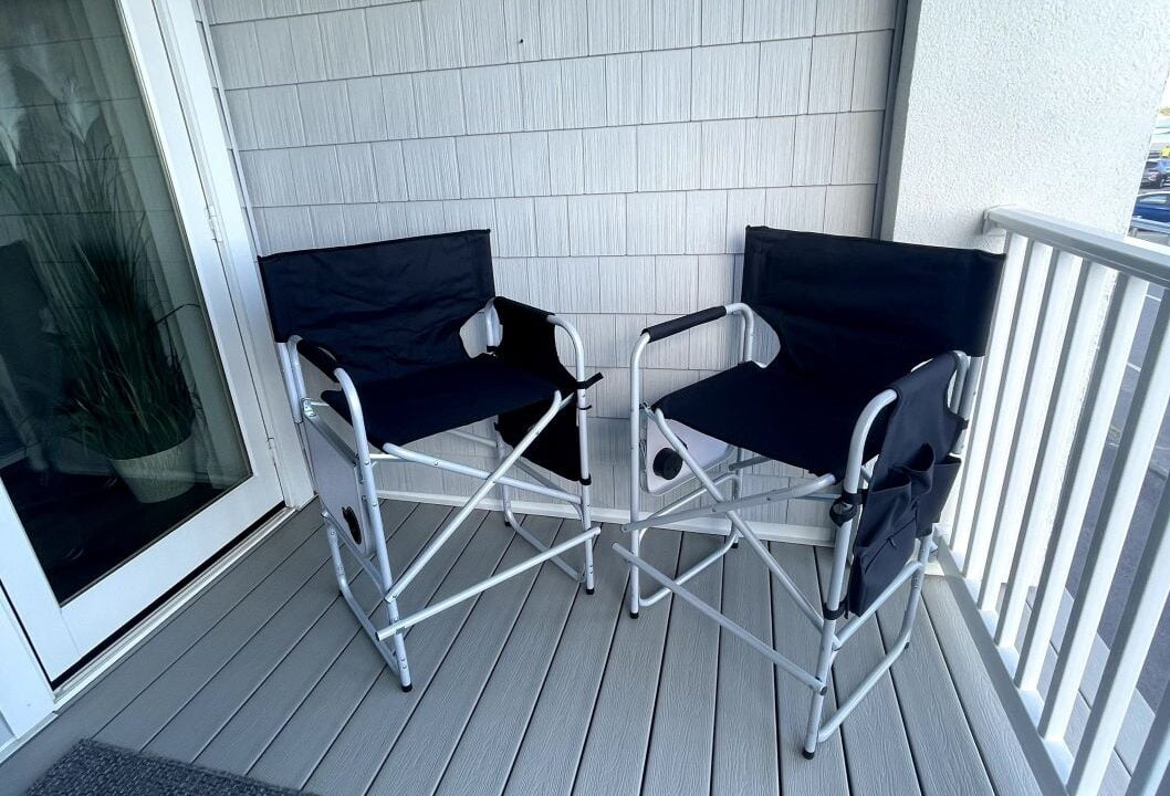 a couple of chairs sitting on top of a wooden floor.