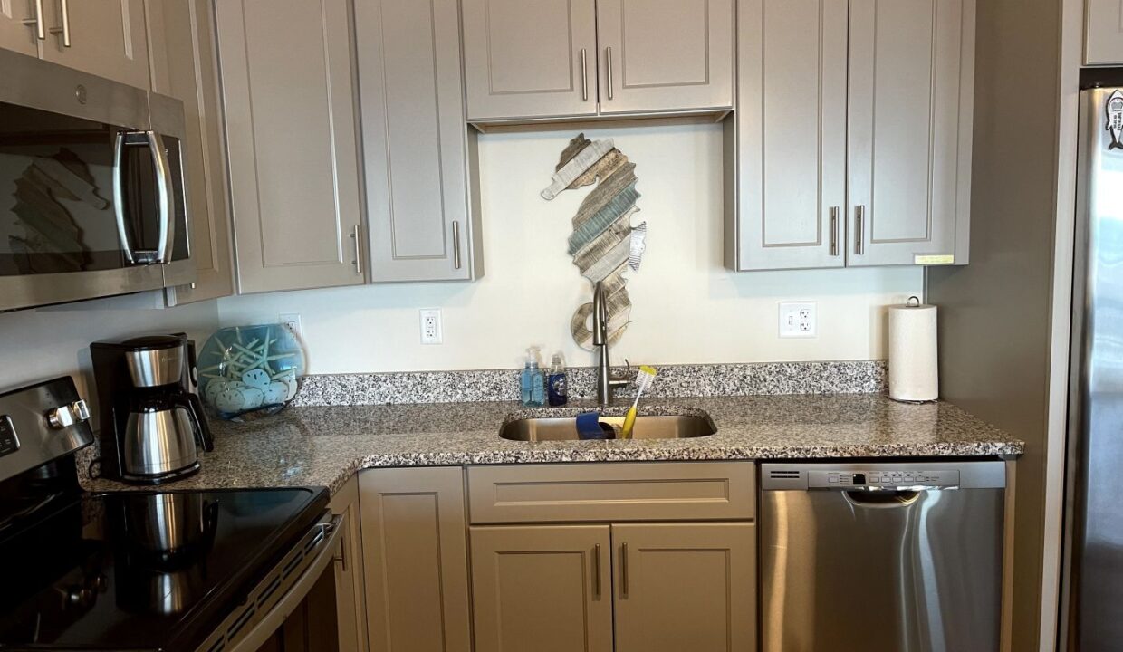 a kitchen with granite counter tops and stainless steel appliances.