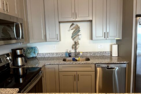 a kitchen with granite counter tops and stainless steel appliances.