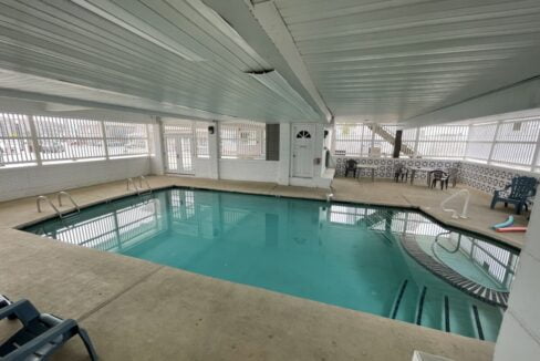 a large indoor swimming pool in a building.