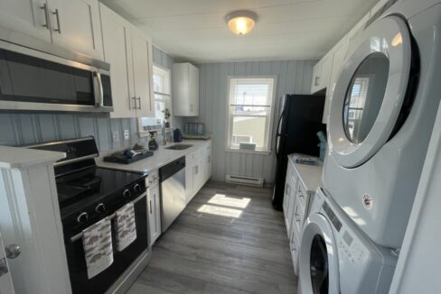 a kitchen with a washer and dryer in it.