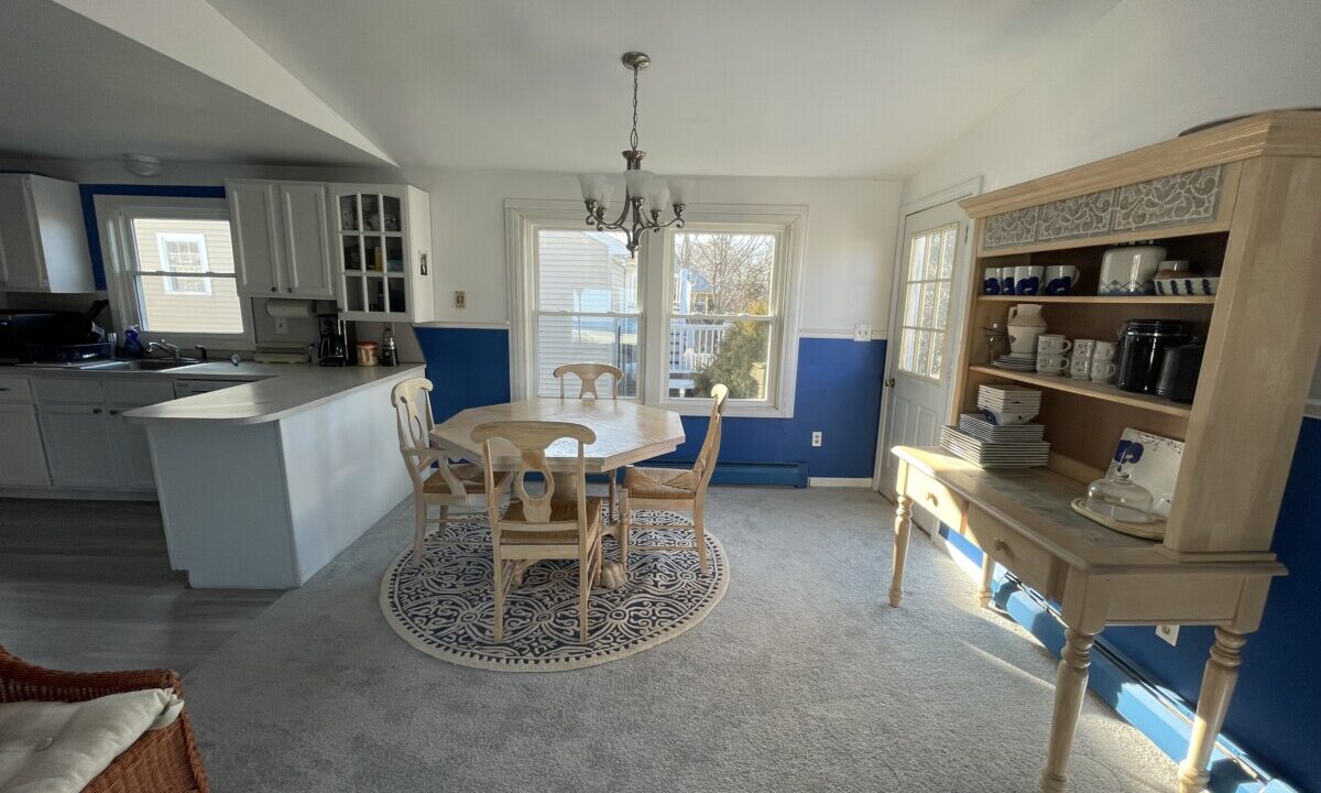 a kitchen with a table and chairs in it.