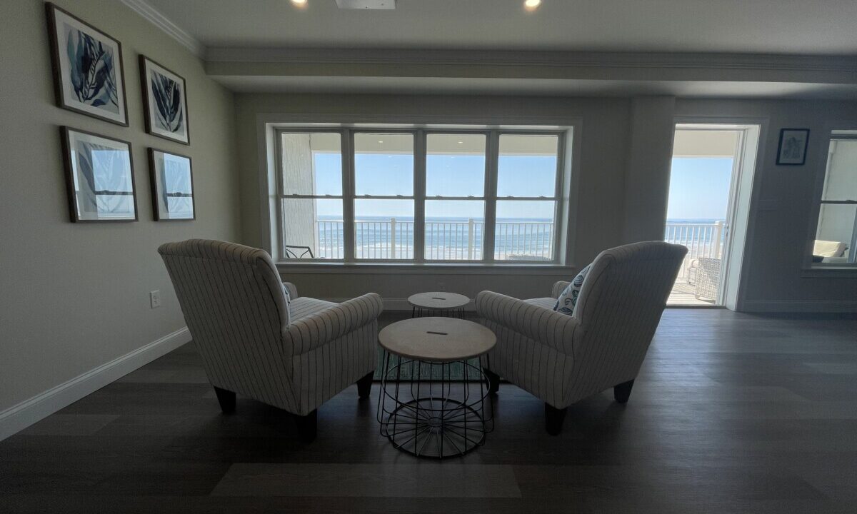 a living room with two chairs and a table.