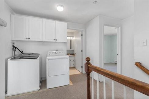 a laundry room with a washer and dryer.