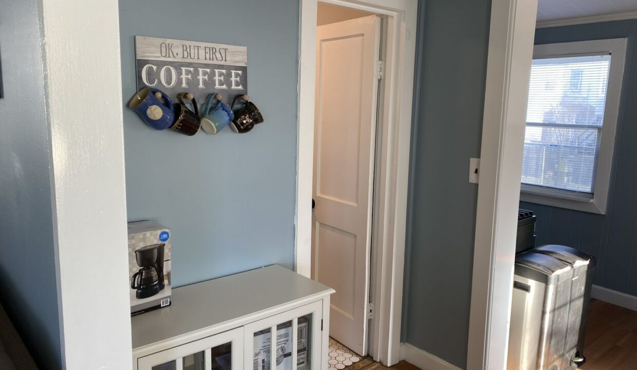 a room with blue walls and a coffee bar.