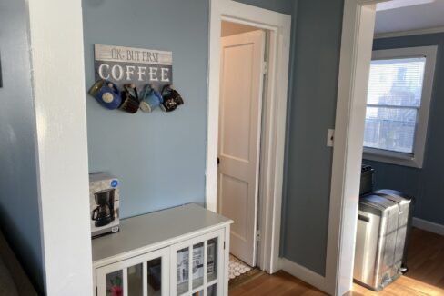a room with blue walls and a coffee bar.