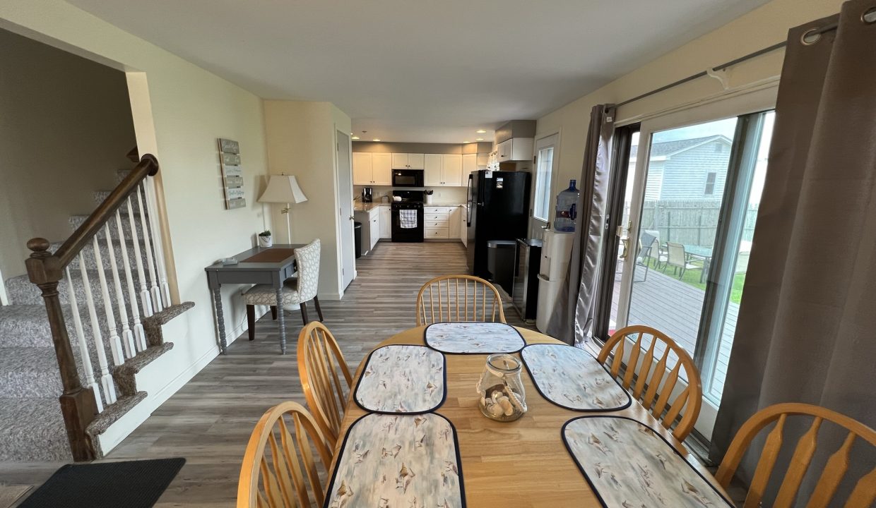 a dining room table with place mats on it.