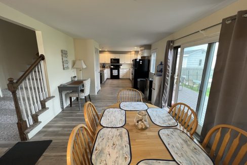 a dining room table with place mats on it.