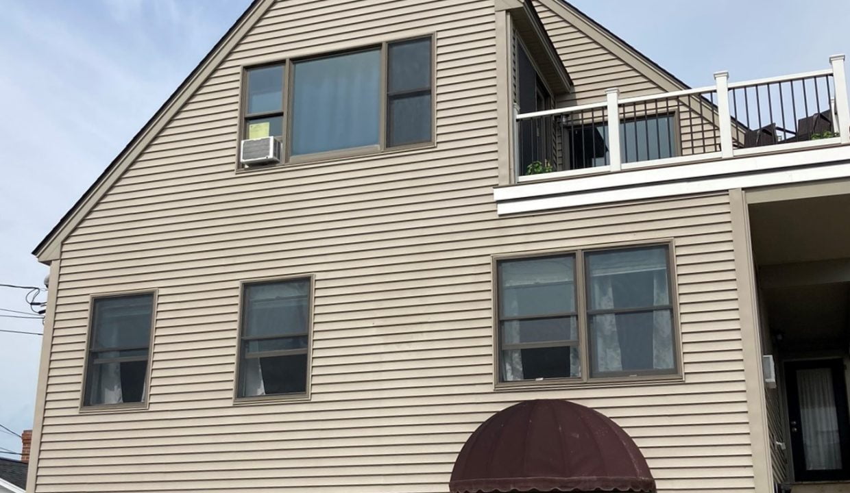 a house with a car parked in front of it.