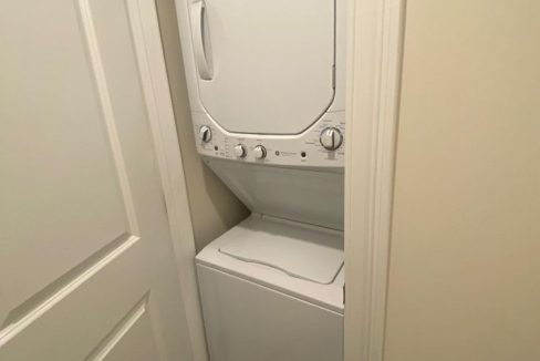 a washer and dryer in a small room.