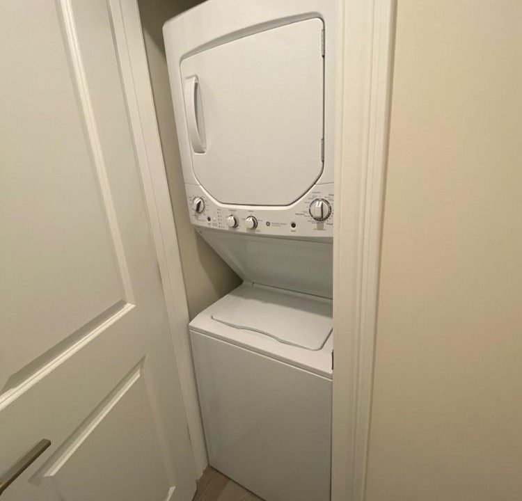 a washer and dryer in a small room.