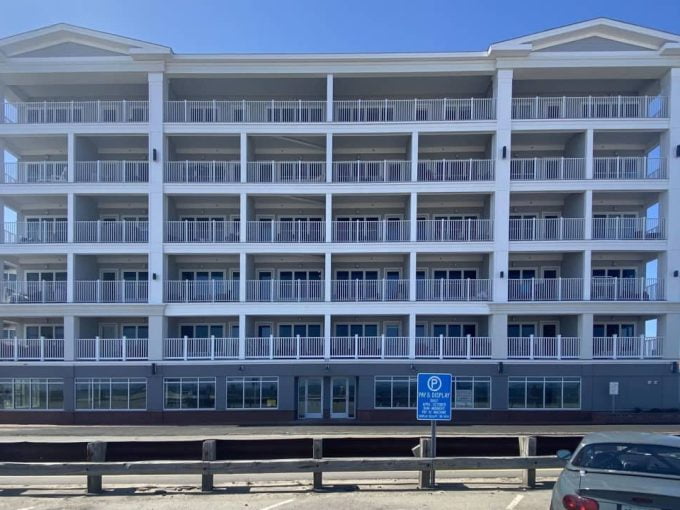 a large white building with balconies and balconies.