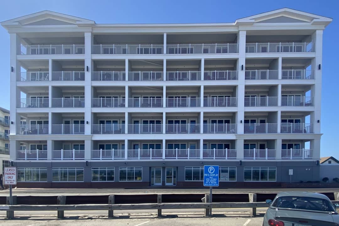 a large white building with balconies and balconies.
