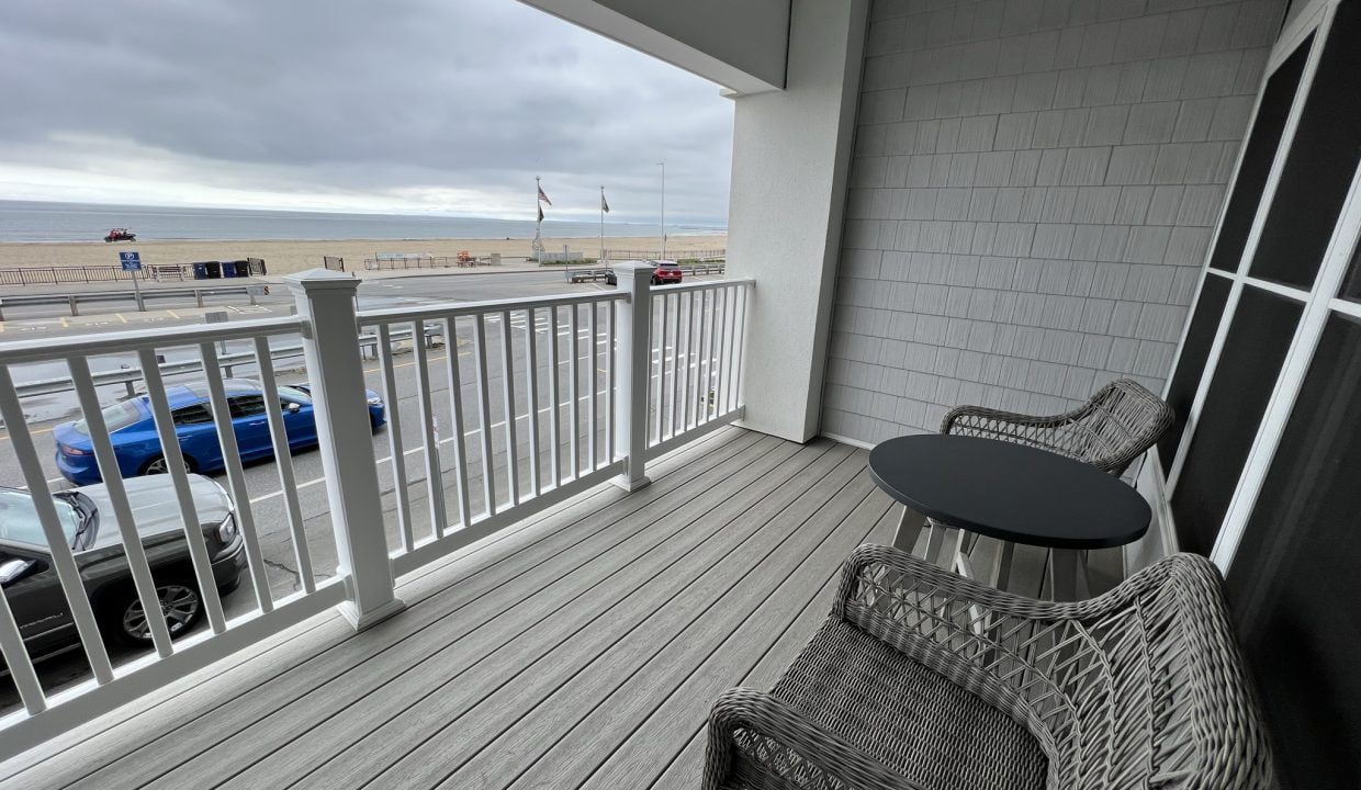 a balcony with a table and chairs on it.