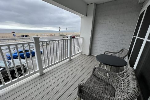 a balcony with a table and chairs on it.