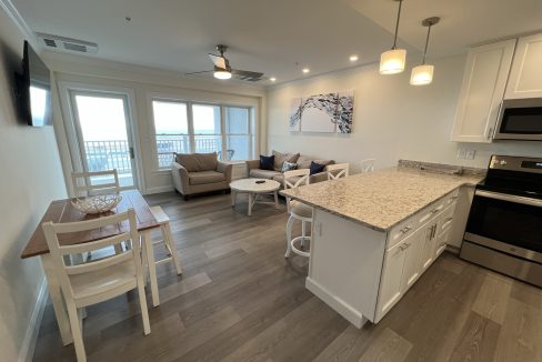 a kitchen and living room area of a home.