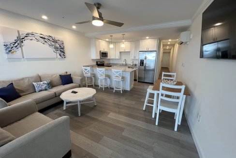 a living room filled with furniture and a flat screen tv.