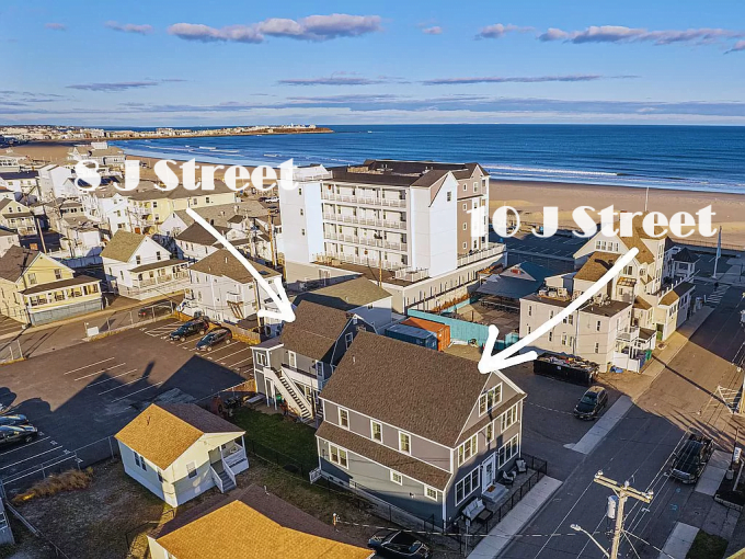 Aerial view of a coastal neighborhood with labeled streets and oceanfront buildings.