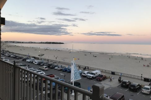 a view of a beach from a balcony.