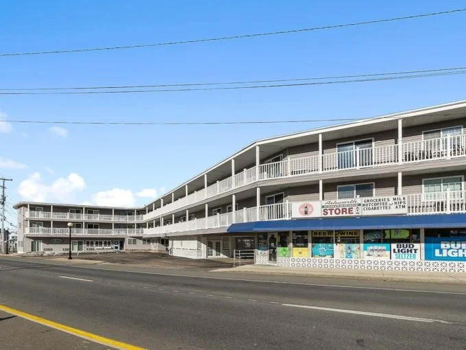 an empty street in front of a building.